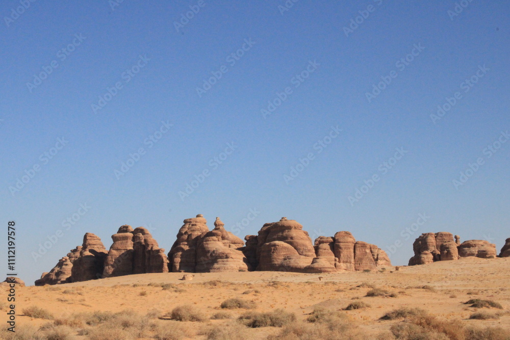 A beautiful view of thousands of years old rocks in the archaeological area of AlUla, Madain Saleh in Saudi Arabia. A beautiful view of thousands of years old rocks in the archaeological area of AlUla, Madain Saleh in Saudi Arabia.
