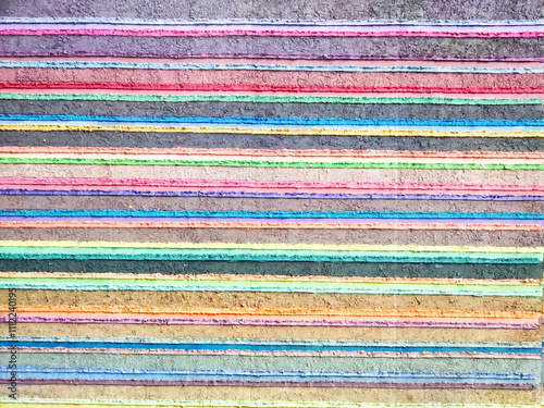 Vibrant textured background featuring colorful horizontal stripes in various hues and tones