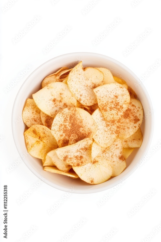 Top-down view of a white bowl filled with golden apple chips dusted with cinnamon, set against a clean white background, showcasing a healthy and delicious snack option Top-down view of a white bowl filled with golden apple chips dusted with cinnamon, set against a clean white background, showcasing a healthy and delicious snack option