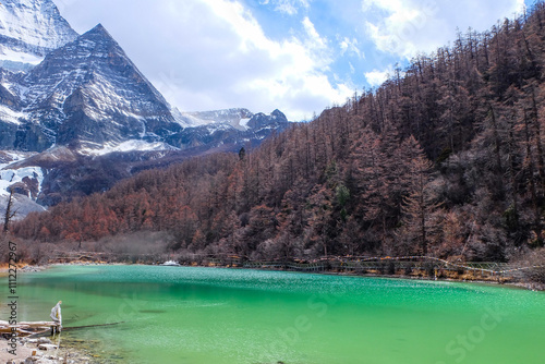 Magnificent Emerald green water at Pearl Lake or Zhuoma la or Zhuomalacuo lake in the Yading Nature Reserve, Sichuan, China  photo