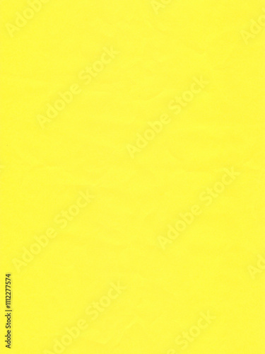 Texture of colored paper, bright yellow crumpled sheet of paper