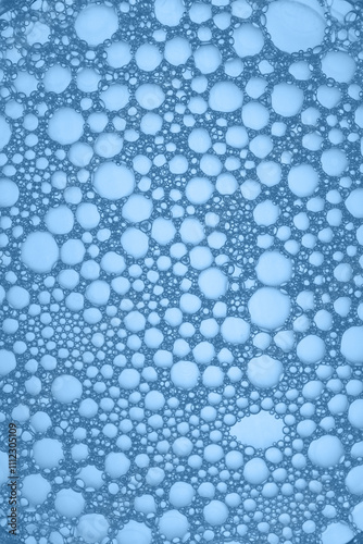 Abstract background of soap bubbles on blue background