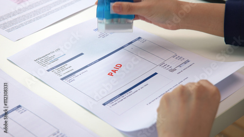 Worker busy work seal getting paying symbol on sales bill form report paper stack. Pay off full amount income tax fee past due date sale office job task. Cash flow debt credit loan risk control budget
