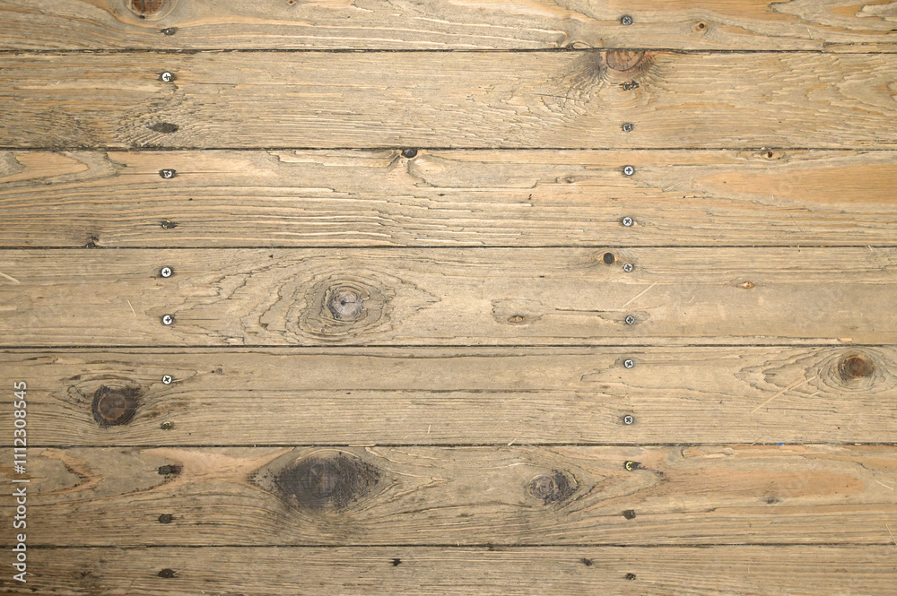 Naklejka premium Textured background of vintage-style wooden boards with hammered nails and screws