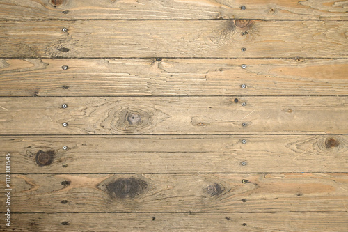 Textured background of vintage-style wooden boards with hammered nails and screws