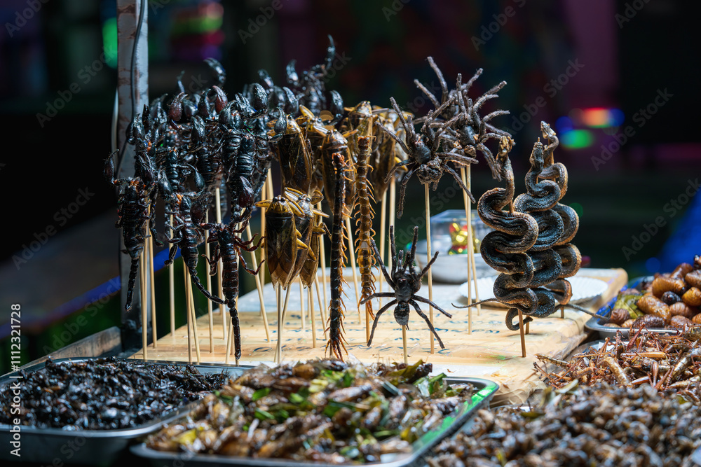 Fried and roasted insects like snakes, scorpions, cockroaches on the ...