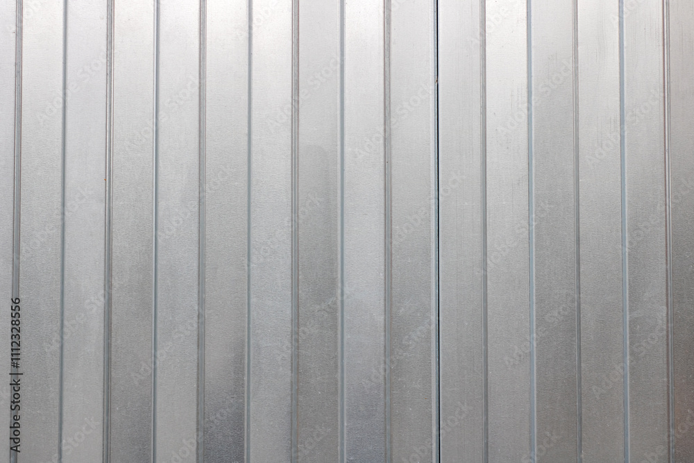 Fototapeta premium This is a closeup view of a metal wall that showcases a striped pattern