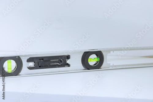 Construction level tool used in construction, showing bubble indicating precise leveling alignment newly shelf