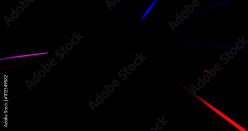 Colorful light beams create a mesmerizing vortex effect in a dark space