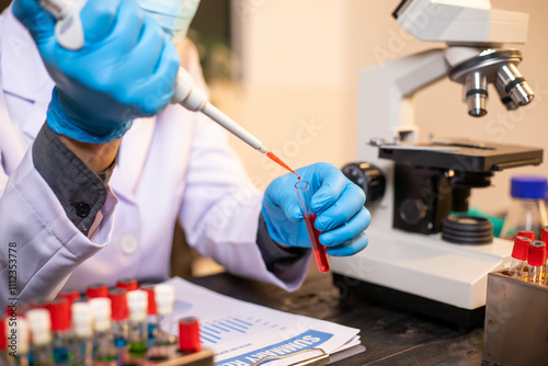 Human hand in glove holding glass jar in modern laboratory. Close-up and long exposure photography.