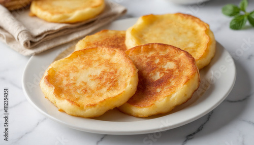 Crisp potato pancakes in close-up style in golden-brown hues for appetizing breakfast with copy space photo