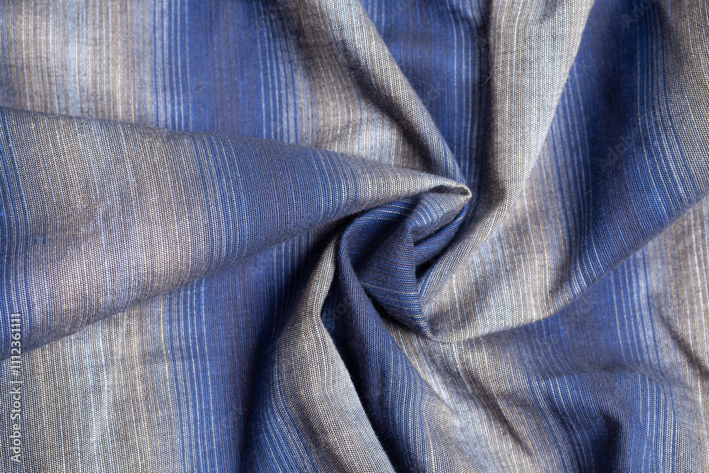 Fototapeta premium Gray blue fabric cloth texture with spiral folds