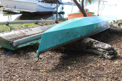 Wooden boats face down at the beach photo