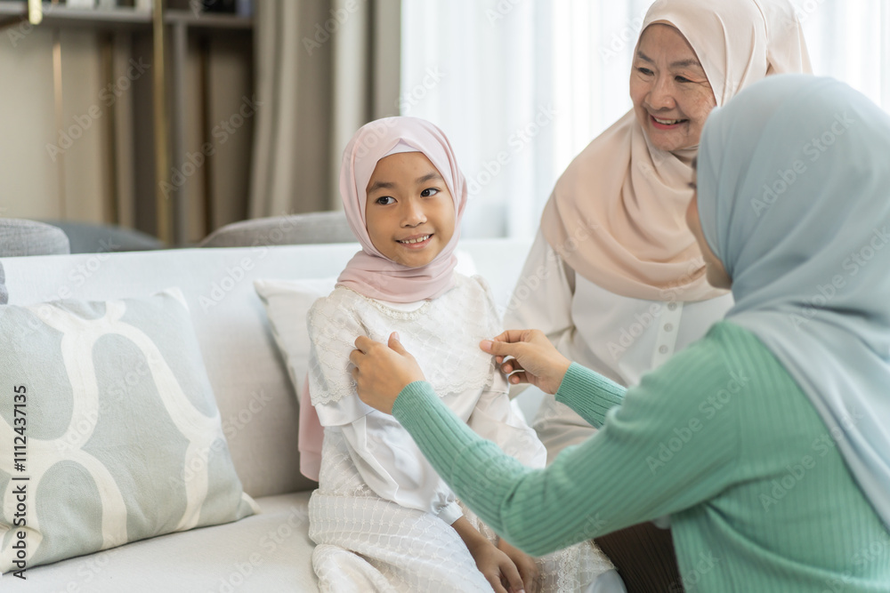 Obraz premium Three generations of muslim woman in hijab enjoying family time showing love, joy and happiness, grandmother, mother, daughters and granddaughter celebrating family traditions togetherness and support