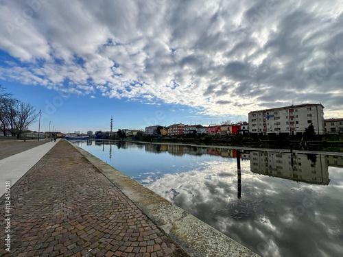 Ferrara waterway and navigable canal in Ferrara at sunset