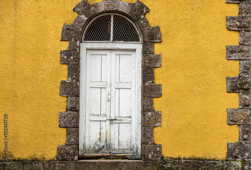 Colorful wooden door on a stone and stucco wall in Addis Ababa, Ethiopia. photo