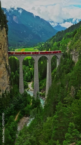 Aerial view Landwasser Viaduct world and Bernina express summer scenery. Railway scenic route in Switzerland
