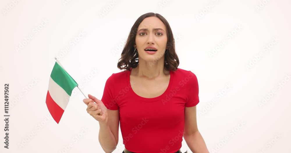 Emotional woman waves Italian flag supporting sports team on white background. Young lady expresses happiness clenching fists at national victory celebration Emotional woman waves Italian flag supporting sports team on white background. Young lady expresses happiness clenching fists at national victory celebration