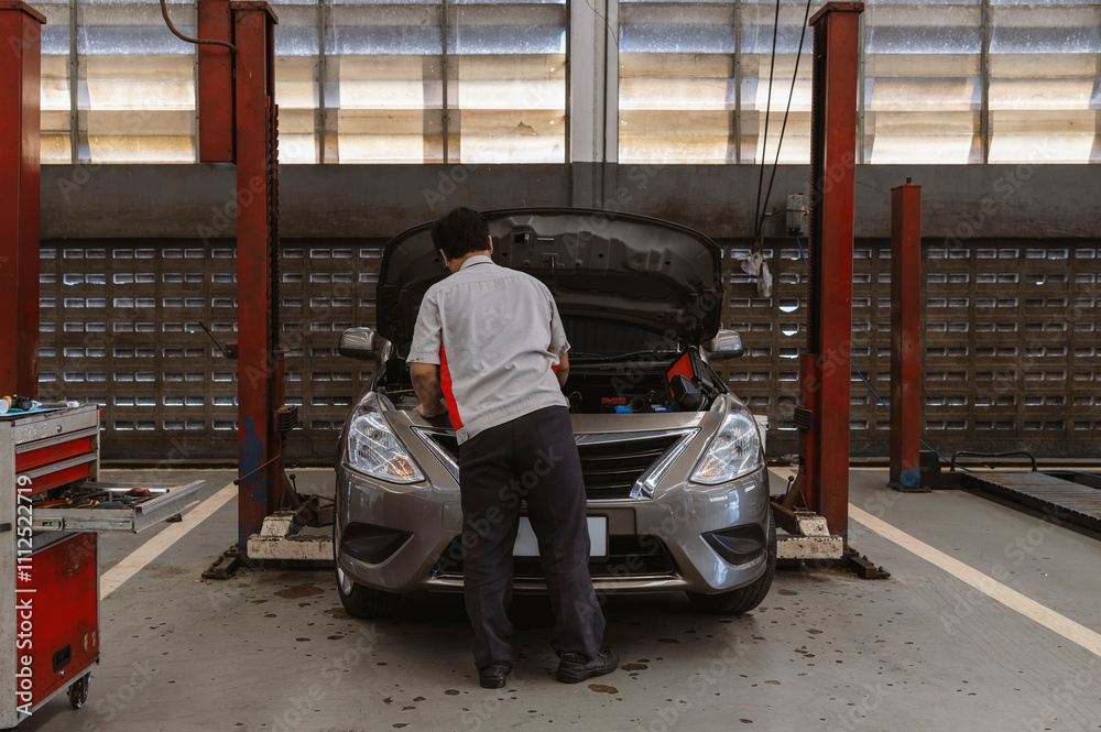 Fototapeta premium car repair station with soft-focus and over light in the background