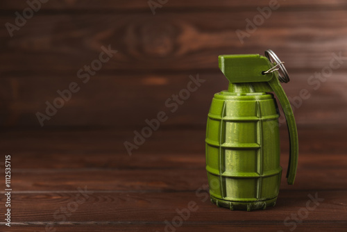 Hand grenade on textured background. Close-up. Weapons of war. Fragmentation grenade detail. Military training concept. Explosive weapon.