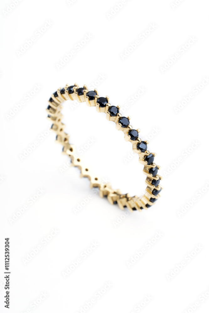 Obraz premium fine gold ring with black shiny stones