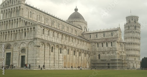 Unesco site. Piazza dei Miracoli.Baptistery, Leaning Tower of Pisa and Pisa Cathedral in white marble stand out on a green lawn. Italy