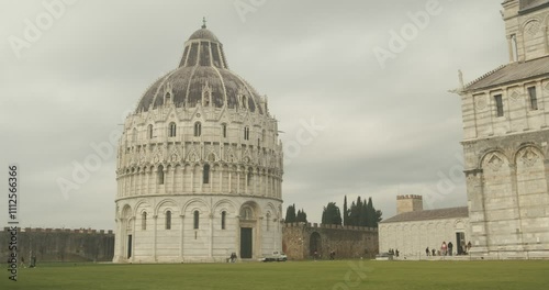 World heritage. Piazza dei Miracoli.Baptistery, Leaning Tower of Pisa and Pisa Cathedral in white marble stand out on a green lawn. Italy