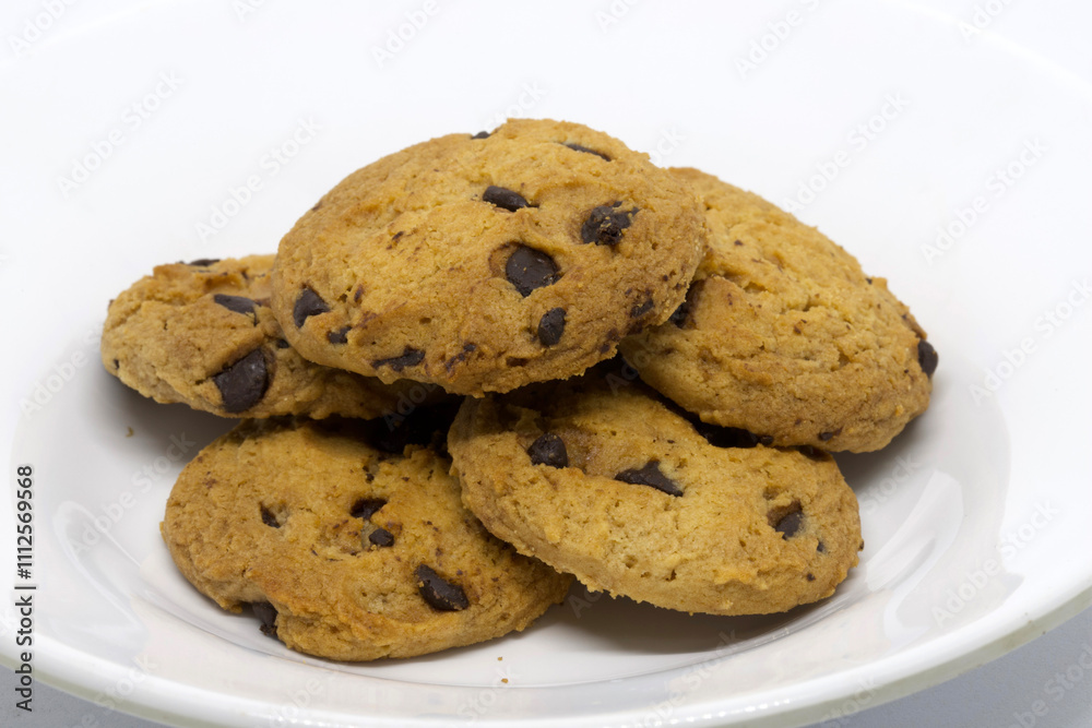 Fresh Chocolate Chip Cookies on a White Plate Ready to Eat Fresh Chocolate Chip Cookies on a White Plate Ready to Eat