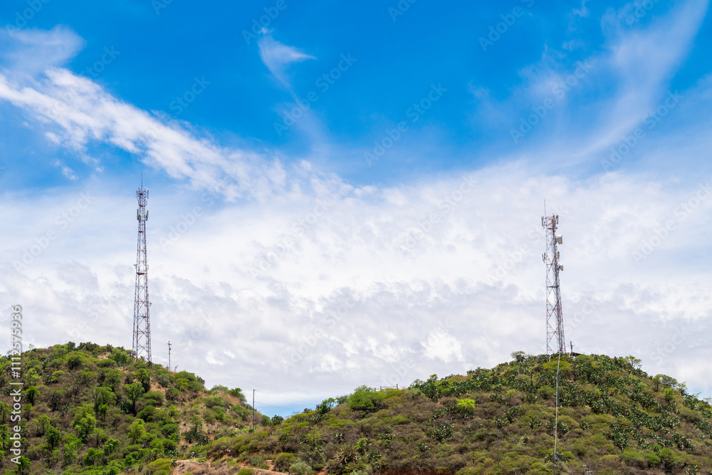 Close up on a telecommunication tower in the background a blue sky with clouds
Close up on a telecommunication tower in the background a blue sky with clouds