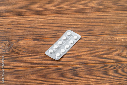 The blister pack containing white tablets, is neatly arranged in two rows