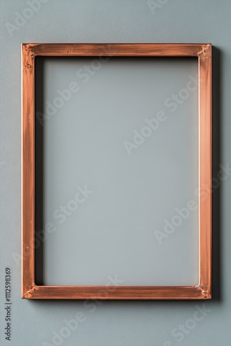 Copper frame on teal wall with ample space for design photo
