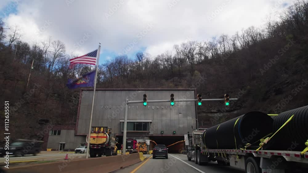 Entering Fort Pitt tunnel on multi-lane roadway interstate from car point of view pov and perspective before Pittsburgh, Pennsylvania Mount Washington area