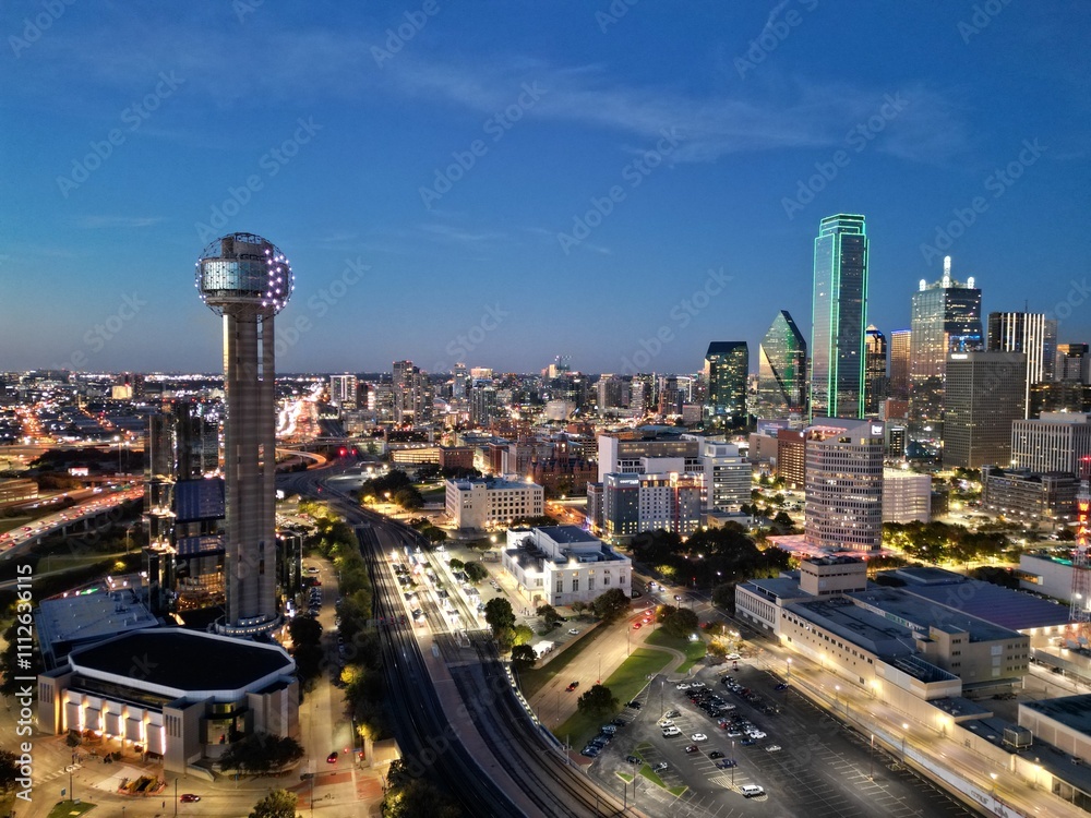 Fototapeta premium Dallas Texas cityscape at night Stunning aerial drone shot capturing the illuminated skyline, skyscrapers, and urban landscape of downtown Dallas. Perfect for projects requiring a modern dynamic city