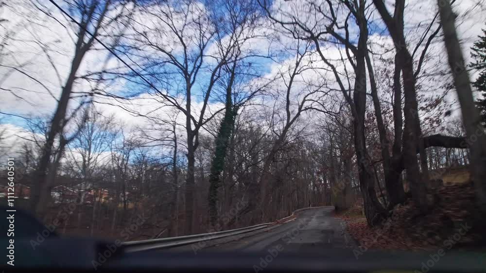 Car perspective of pov point of view moving towards Pittsburgh, Pennsylvania roads, neighborhoods, town, and buildings on hilly and bumpy terrain Car perspective of pov point of view moving towards Pittsburgh, Pennsylvania roads, neighborhoods, town, and buildings on hilly and bumpy terrain