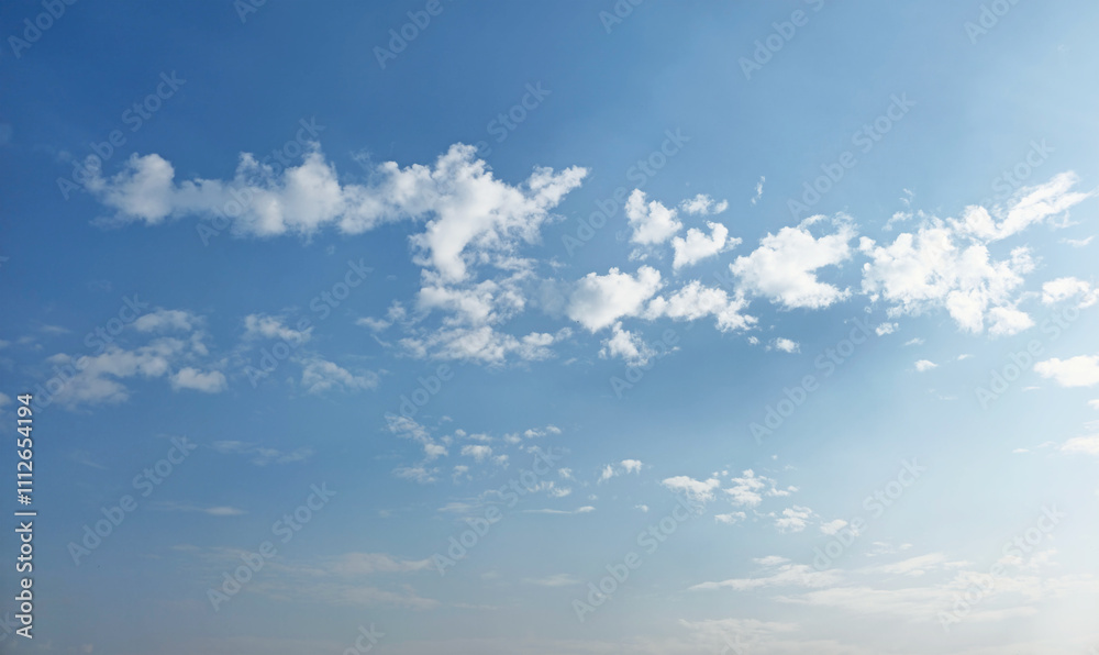 Fototapeta premium Summer evening or winter evening blue sky cloud gradient light white background. Gloomy vivid cyan. Morning sky looked like a bright golden sky. Sunrise is decorated with clouds in various shapes.