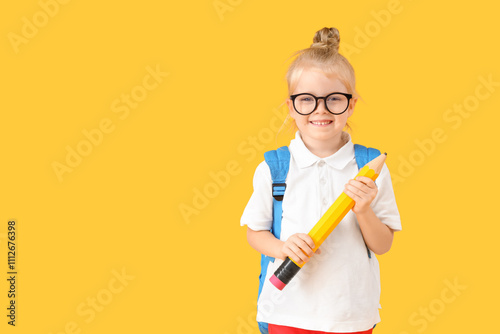 Cute little schoolgirl with...