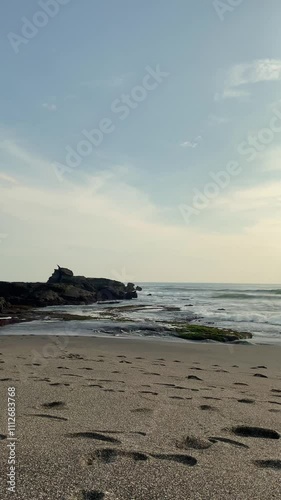 Waves Colliding with Beach Stones in Bali’s Coastal Beauty