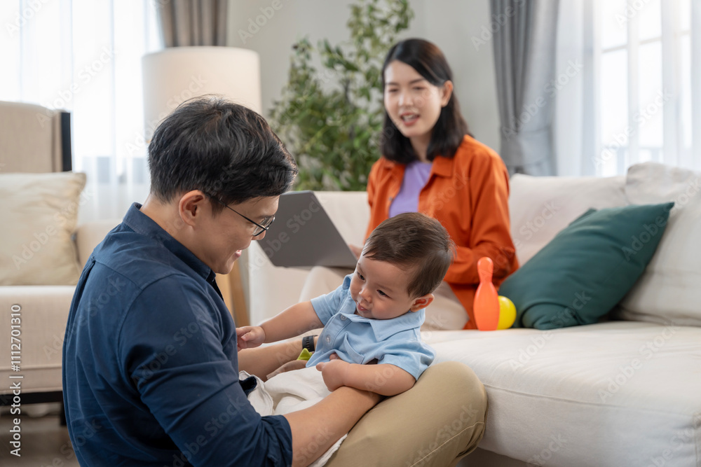 Asian baby and families who have to work while raising children at home Asian baby and families who have to work while raising children at home
