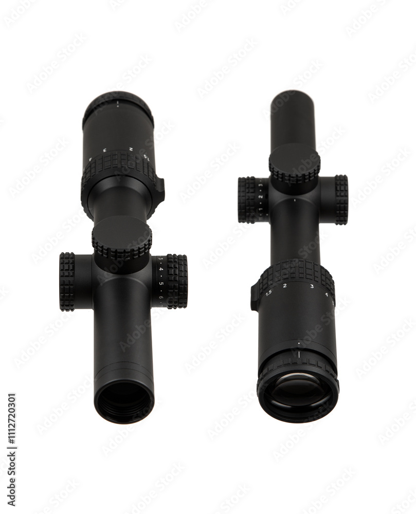 Black rifle scope with adjustment knobs and magnification settings, isolated on a white background. Black rifle scope with adjustment knobs and magnification settings, isolated on a white background.