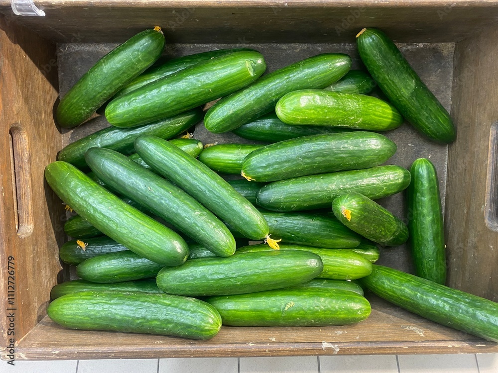 Cucumbers in a box on sale. Cucumbers in the store
Cucumbers in a box on sale. Cucumbers in the store