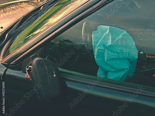 Opened airbag in automobile. Car safety equipment