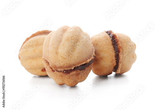 Sweet walnut shaped cookies with boiled condensed milk on white background photo