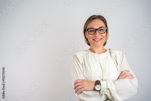 Beautiful woman smiling with crossed arms. Happy Self-Assured Woman On Isolated Background. Happy female designer standing isolated