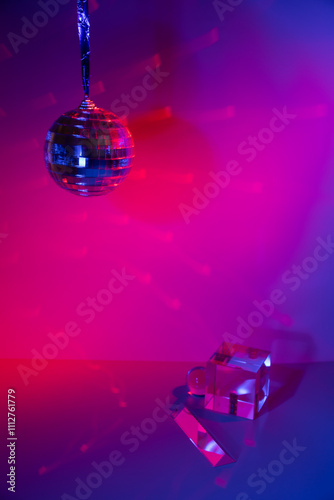 Glass prisms and a ball in colored light