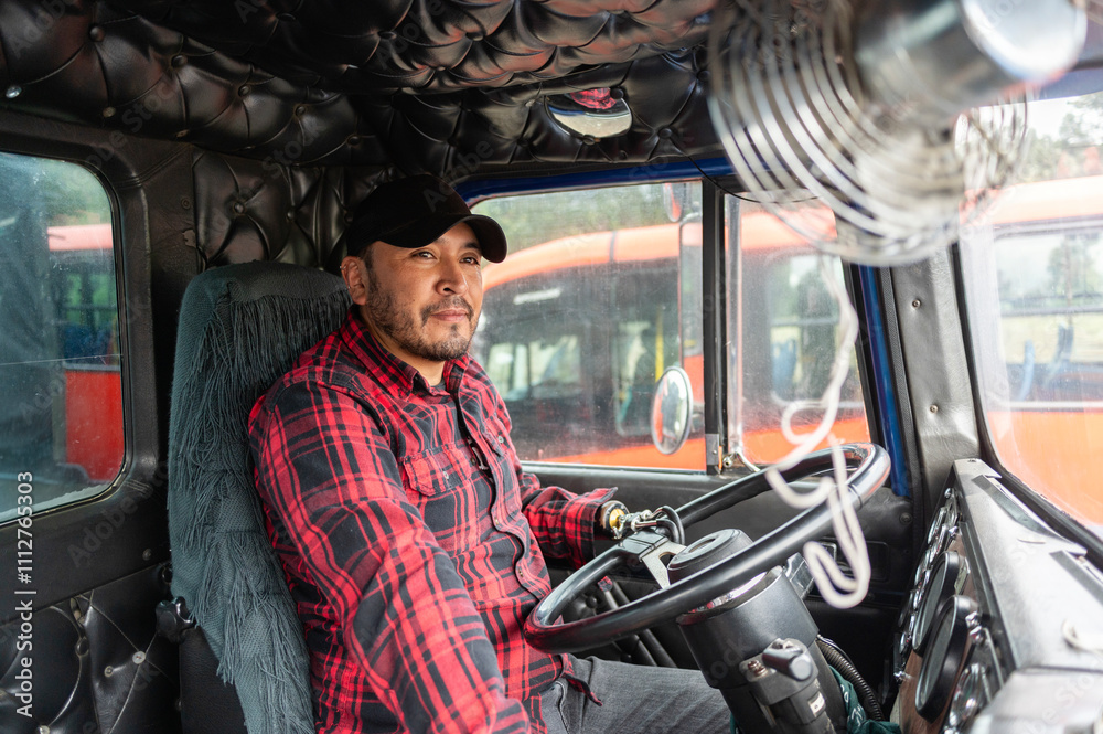 Truck driver with prosthetic hand driving, seen from inside Truck driver with prosthetic hand driving, seen from inside