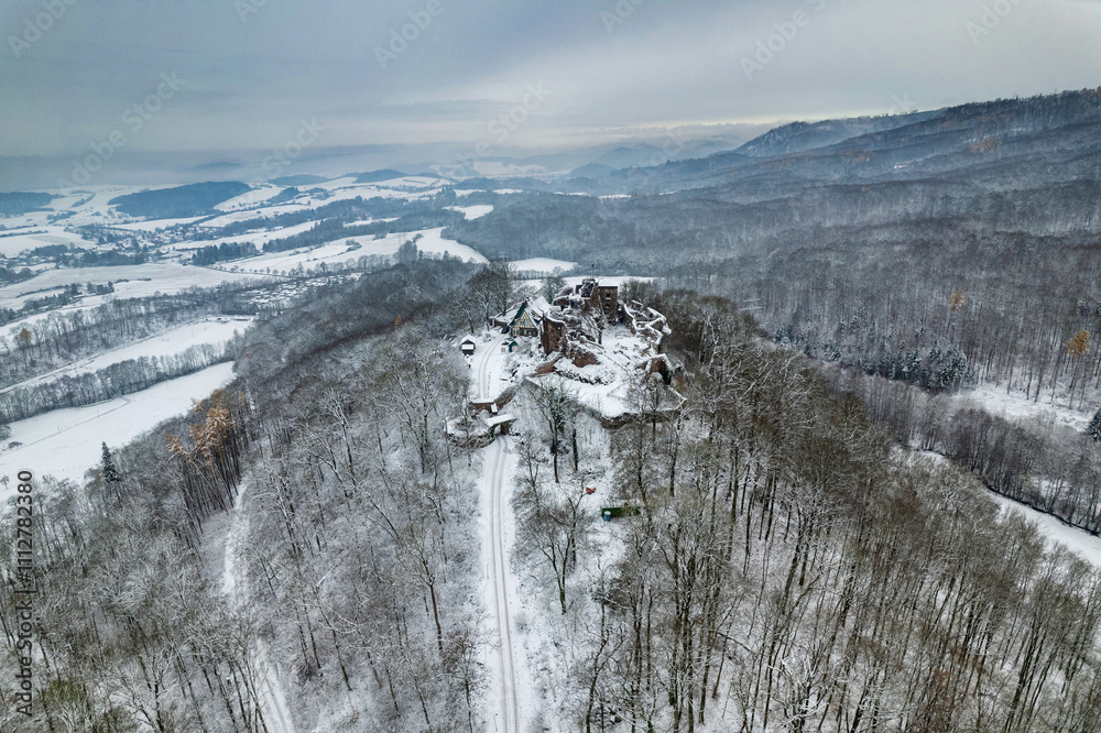 Aerial view ruins of old castle. Winter. Ruin of Hohnstein Castle, Harz mountains, Germany.