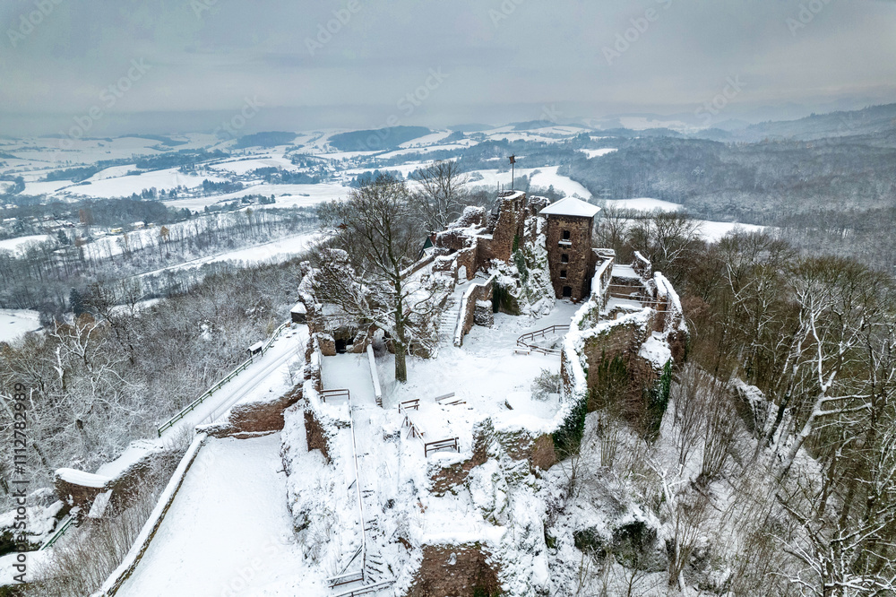Aerial view ruins of old castle. Winter. Ruin of Hohnstein Castle, Harz mountains, Germany.