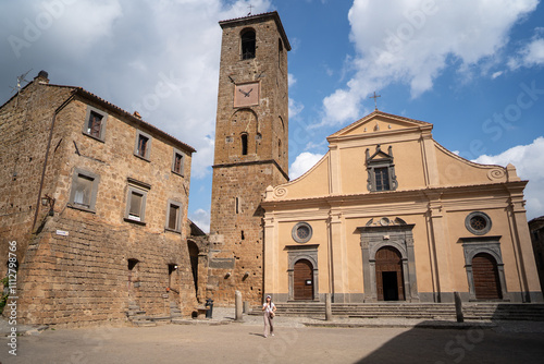 Historic church and bell tower under a partly cloudy sky photo