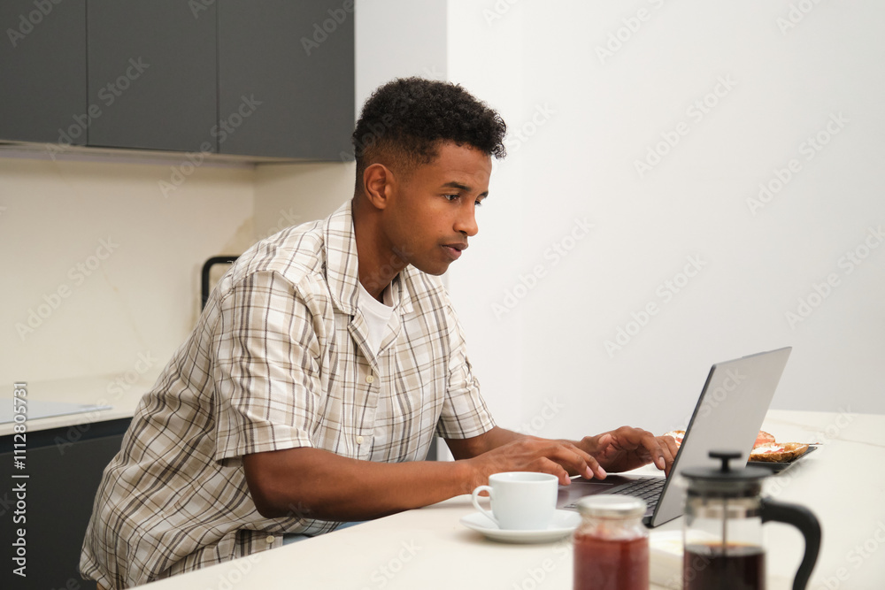 Young Black Man Enjoys Relaxed Moments at Home Together Young Black Man Enjoys Relaxed Moments at Home Together