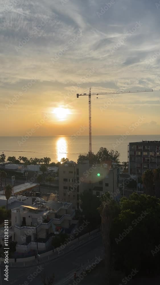 Tower Crane on formworks. Crane and building construction. Construction crane on Housing. Sea, sunrise Tower Crane on formworks. Crane and building construction. Construction crane on Housing. Sea, sunrise